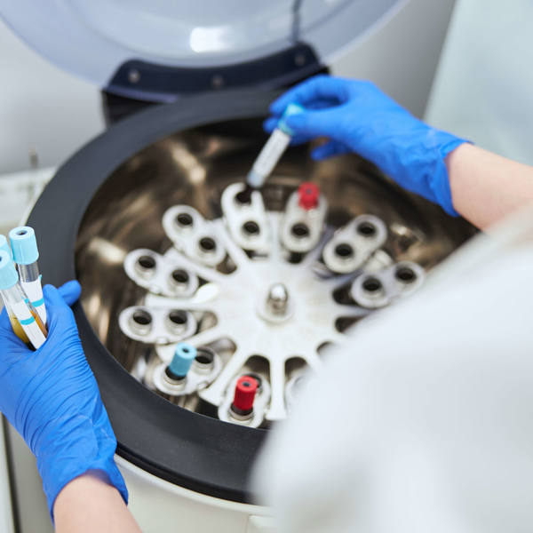NMR Biochemist Placing Vacutainers With Sodium Citrate